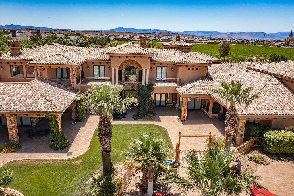 The Estate in Washington, a luxurious home with over 0.5 acre pond plenty of space for parking offering resort style pool, full sports court, theatre room, indoor gym, full bar, pavillion & indoor basketball court and  is now available for sale. This home located at 90 W Triple Crown Ln, Washington, Utah