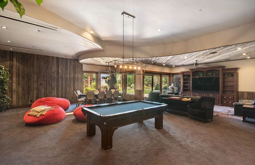 The Estate in Washington, a luxurious home with over 0.5 acre pond plenty of space for parking offering resort style pool, full sports court, theatre room, indoor gym, full bar, pavillion & indoor basketball court and  is now available for sale. This home located at 90 W Triple Crown Ln, Washington, Utah