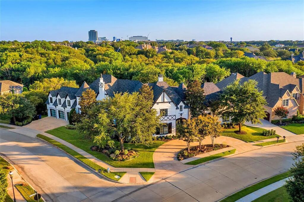 The Home in Frisco, an extraordinary modified Tudor style custom estate offers multiple spaces for entertaining and luxury amenities including onsite splash pad, pool and spa, two story terrace with balcony, theater room, game room, wine cellar and more is now available for sale. This home located at 6267 Sweeney Trl, Frisco, Texas