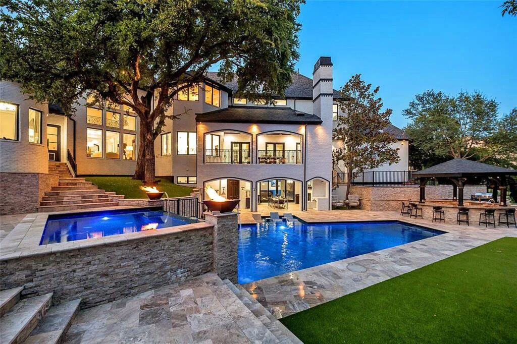 The Home in Frisco, an extraordinary modified Tudor style custom estate offers multiple spaces for entertaining and luxury amenities including onsite splash pad, pool and spa, two story terrace with balcony, theater room, game room, wine cellar and more is now available for sale. This home located at 6267 Sweeney Trl, Frisco, Texas
