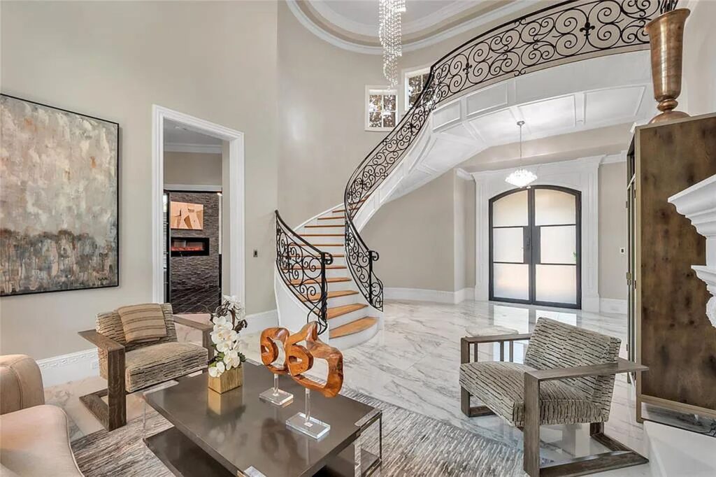 The Home in Frisco, an extraordinary modified Tudor style custom estate offers multiple spaces for entertaining and luxury amenities including onsite splash pad, pool and spa, two story terrace with balcony, theater room, game room, wine cellar and more is now available for sale. This home located at 6267 Sweeney Trl, Frisco, Texas