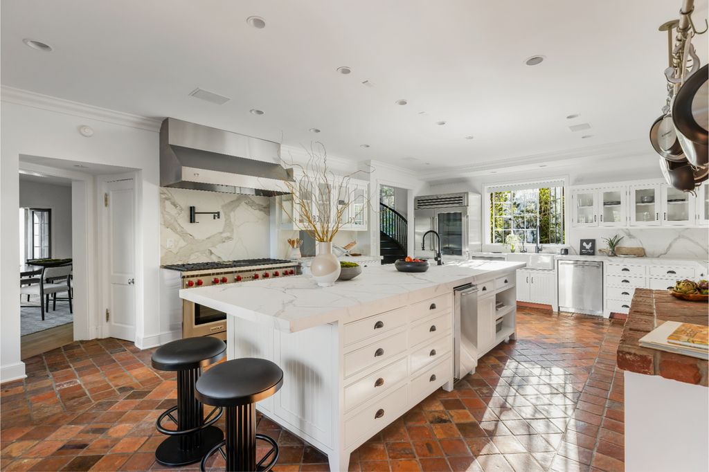 The Estate in Pacific Palisades, a newly renovated home on a double lot comprised of nearly 1.4 acres with park-like grounds that include an incredible pool and spa, cabana, guest house, expansive yard and tennis court is now available for sale. This home located at 1575 Capri Dr, Pacific Palisades, California