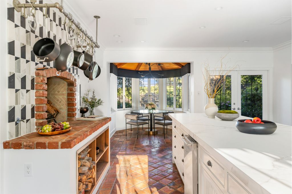 The Estate in Pacific Palisades, a newly renovated home on a double lot comprised of nearly 1.4 acres with park-like grounds that include an incredible pool and spa, cabana, guest house, expansive yard and tennis court is now available for sale. This home located at 1575 Capri Dr, Pacific Palisades, California