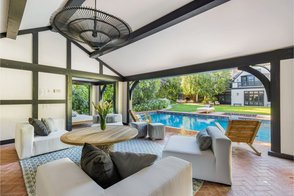 The Estate in Pacific Palisades, a newly renovated home on a double lot comprised of nearly 1.4 acres with park-like grounds that include an incredible pool and spa, cabana, guest house, expansive yard and tennis court is now available for sale. This home located at 1575 Capri Dr, Pacific Palisades, California