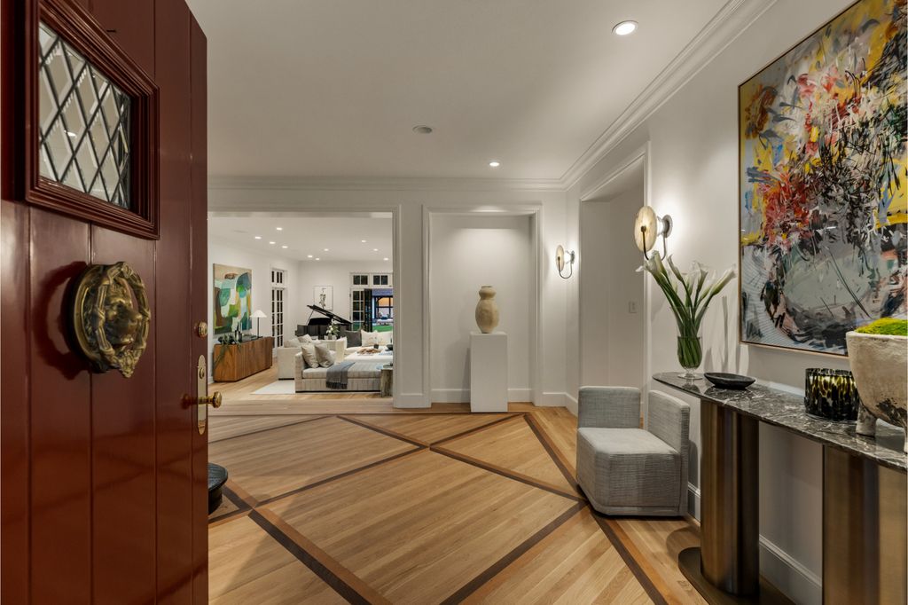 The Estate in Pacific Palisades, a newly renovated home on a double lot comprised of nearly 1.4 acres with park-like grounds that include an incredible pool and spa, cabana, guest house, expansive yard and tennis court is now available for sale. This home located at 1575 Capri Dr, Pacific Palisades, California