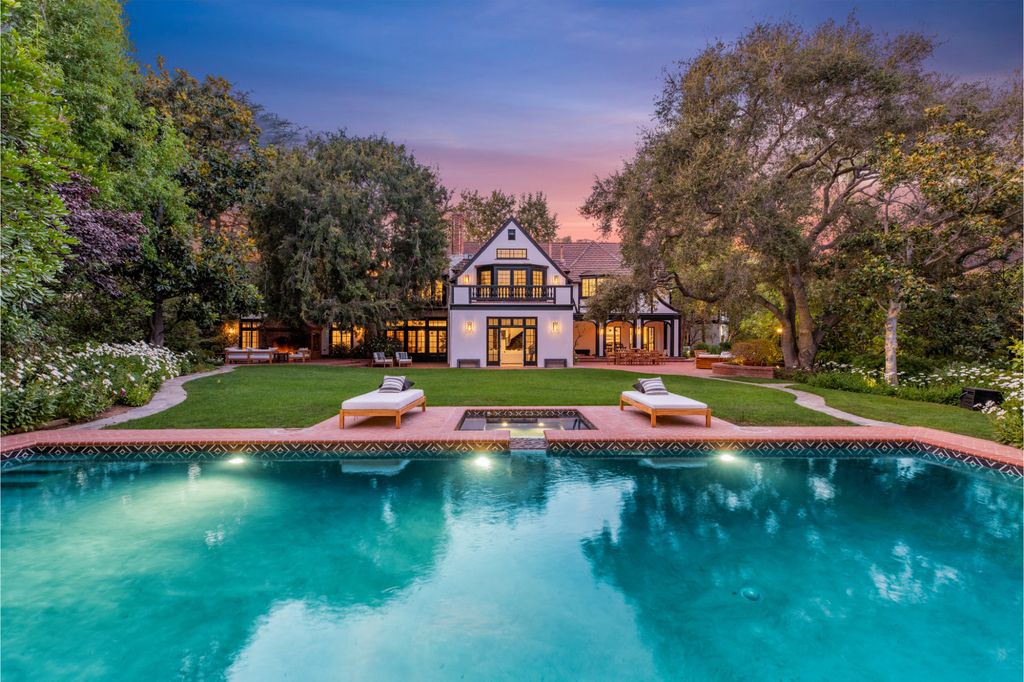 The Estate in Pacific Palisades, a newly renovated home on a double lot comprised of nearly 1.4 acres with park-like grounds that include an incredible pool and spa, cabana, guest house, expansive yard and tennis court is now available for sale. This home located at 1575 Capri Dr, Pacific Palisades, California