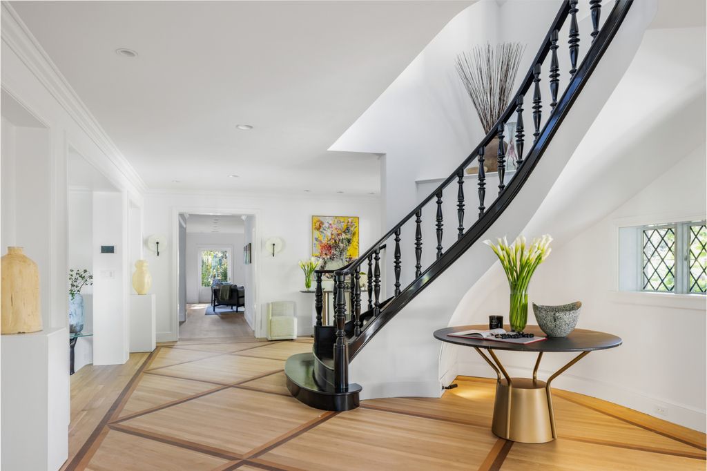The Estate in Pacific Palisades, a newly renovated home on a double lot comprised of nearly 1.4 acres with park-like grounds that include an incredible pool and spa, cabana, guest house, expansive yard and tennis court is now available for sale. This home located at 1575 Capri Dr, Pacific Palisades, California