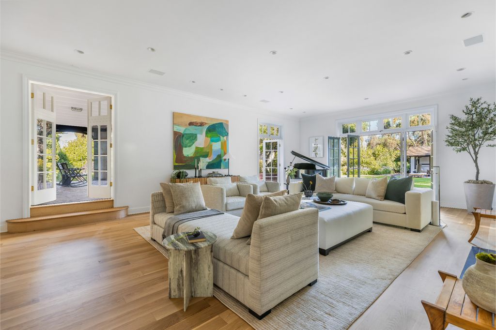 The Estate in Pacific Palisades, a newly renovated home on a double lot comprised of nearly 1.4 acres with park-like grounds that include an incredible pool and spa, cabana, guest house, expansive yard and tennis court is now available for sale. This home located at 1575 Capri Dr, Pacific Palisades, California