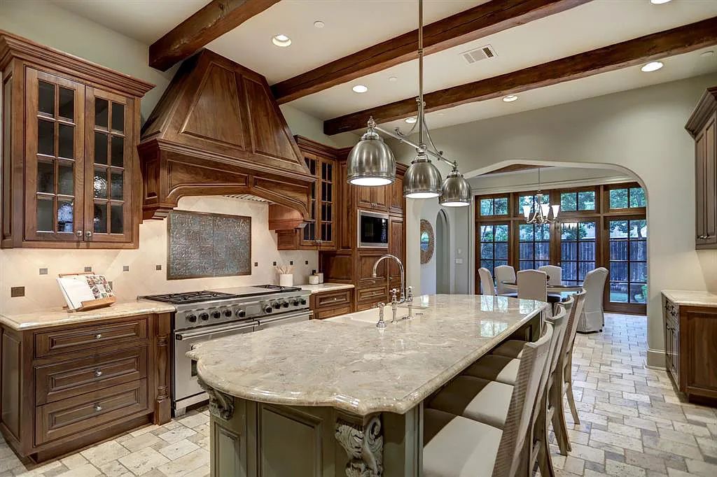 The Estate in Houston, a breathtaking home has loads of curb appeal with meticulously maintained grounds, elegant sconces, and stunning red brick, captivating backyard perfect for entertaining is now available for sale. This home located at 11320 Green Vale Dr, Houston, Texas