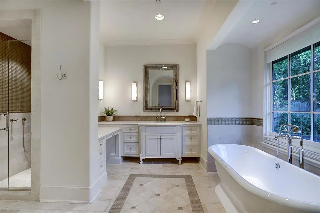 The Estate in Houston, a breathtaking home has loads of curb appeal with meticulously maintained grounds, elegant sconces, and stunning red brick, captivating backyard perfect for entertaining is now available for sale. This home located at 11320 Green Vale Dr, Houston, Texas
