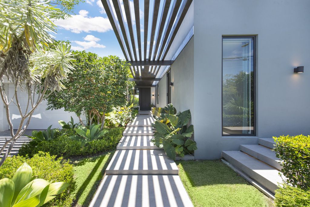 The Villa in Miami Beach, a custom exquisite waterfront home in the prestigious 24H guard gated community Biscayne Pointe offering 60 feet of waterfrontage with new dock is now available for sale. This home located at 8055 Noremac Ave, Miami Beach, Florida