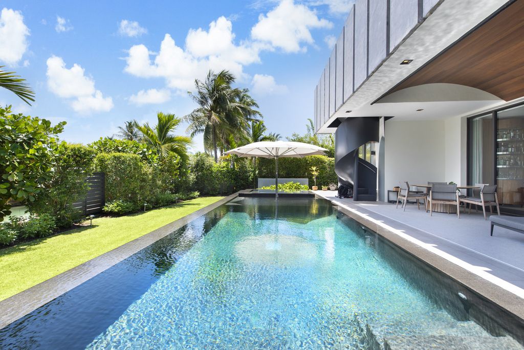 The Villa in Miami Beach, a custom exquisite waterfront home in the prestigious 24H guard gated community Biscayne Pointe offering 60 feet of waterfrontage with new dock is now available for sale. This home located at 8055 Noremac Ave, Miami Beach, Florida