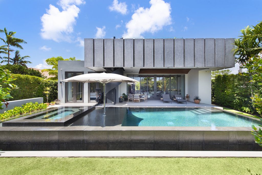 The Villa in Miami Beach, a custom exquisite waterfront home in the prestigious 24H guard gated community Biscayne Pointe offering 60 feet of waterfrontage with new dock is now available for sale. This home located at 8055 Noremac Ave, Miami Beach, Florida