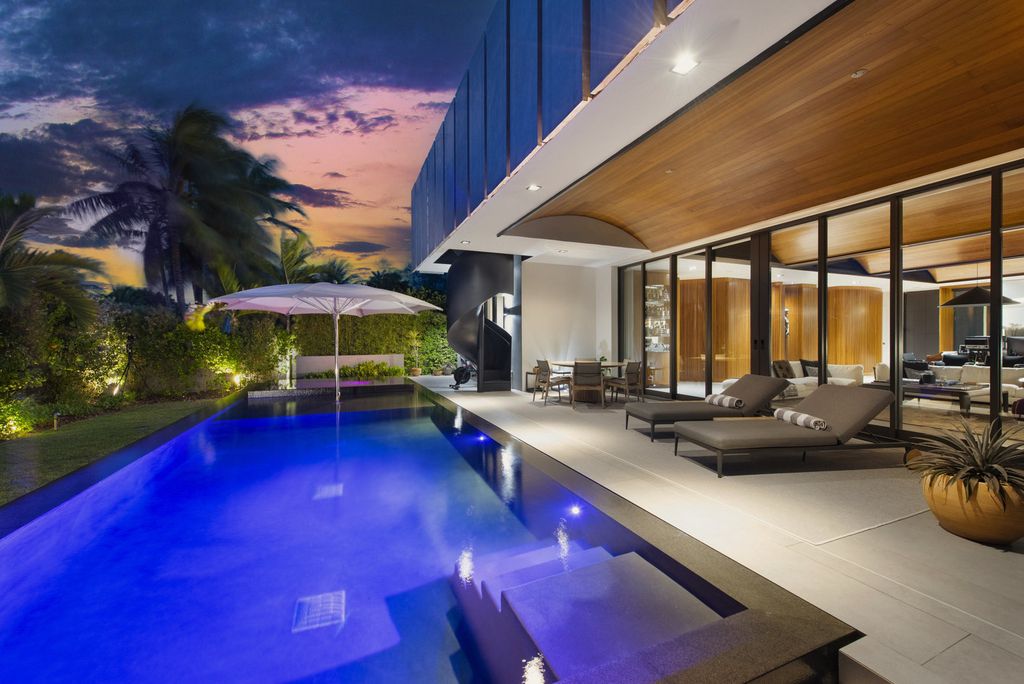 The Villa in Miami Beach, a custom exquisite waterfront home in the prestigious 24H guard gated community Biscayne Pointe offering 60 feet of waterfrontage with new dock is now available for sale. This home located at 8055 Noremac Ave, Miami Beach, Florida