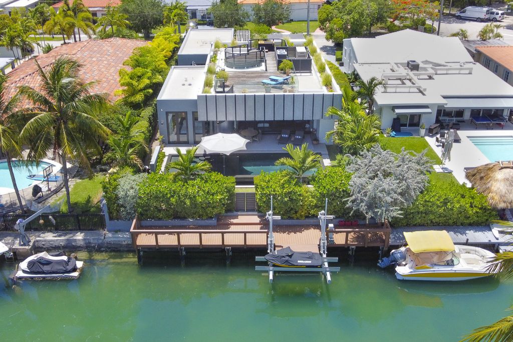 The Villa in Miami Beach, a custom exquisite waterfront home in the prestigious 24H guard gated community Biscayne Pointe offering 60 feet of waterfrontage with new dock is now available for sale. This home located at 8055 Noremac Ave, Miami Beach, Florida