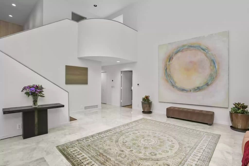 The House in Greenwich blends the verdant outdoors with open living spaces flooded with sunlight, now available for sale. This home located at 48 Lafrentz Rd, Greenwich, Connecticut