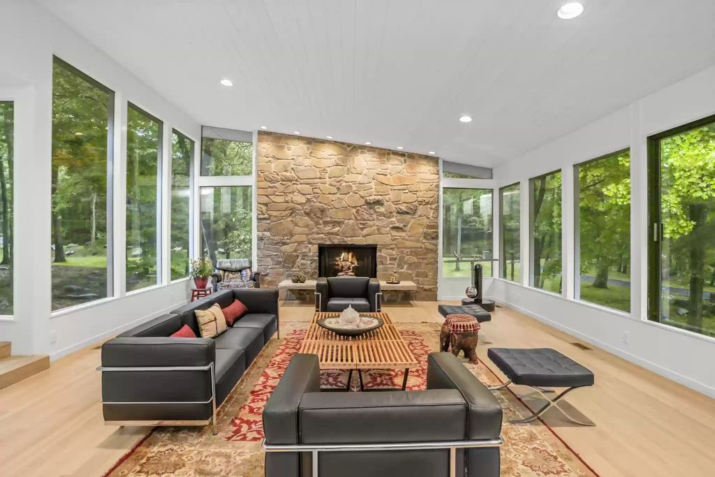 The House in Greenwich blends the verdant outdoors with open living spaces flooded with sunlight, now available for sale. This home located at 48 Lafrentz Rd, Greenwich, Connecticut