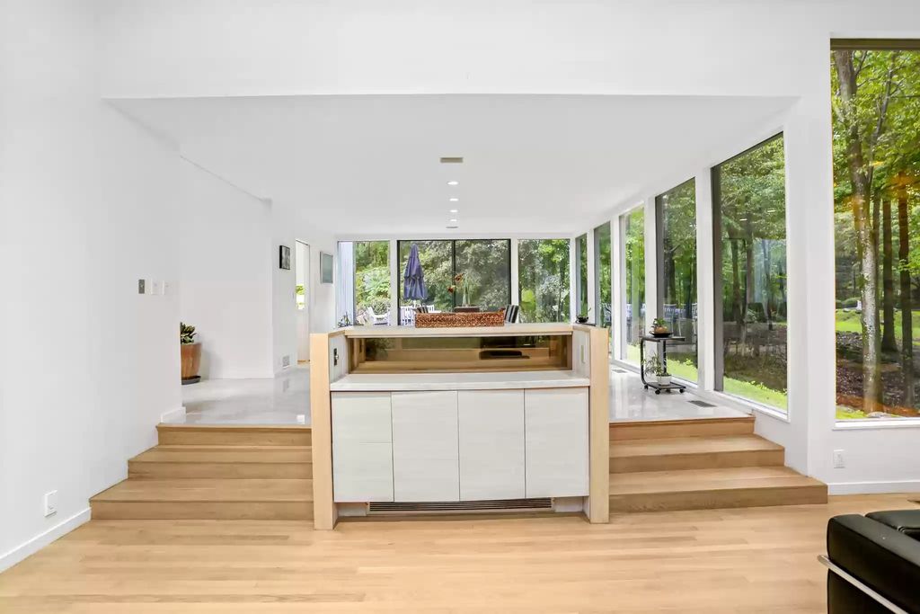 The House in Greenwich blends the verdant outdoors with open living spaces flooded with sunlight, now available for sale. This home located at 48 Lafrentz Rd, Greenwich, Connecticut