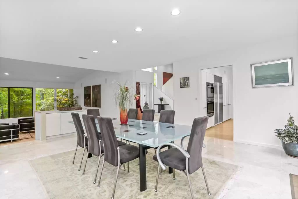 The House in Greenwich blends the verdant outdoors with open living spaces flooded with sunlight, now available for sale. This home located at 48 Lafrentz Rd, Greenwich, Connecticut