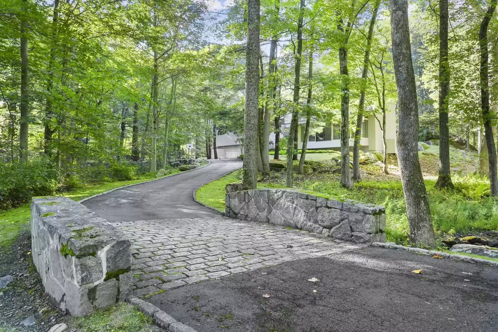 The House in Greenwich blends the verdant outdoors with open living spaces flooded with sunlight, now available for sale. This home located at 48 Lafrentz Rd, Greenwich, Connecticut