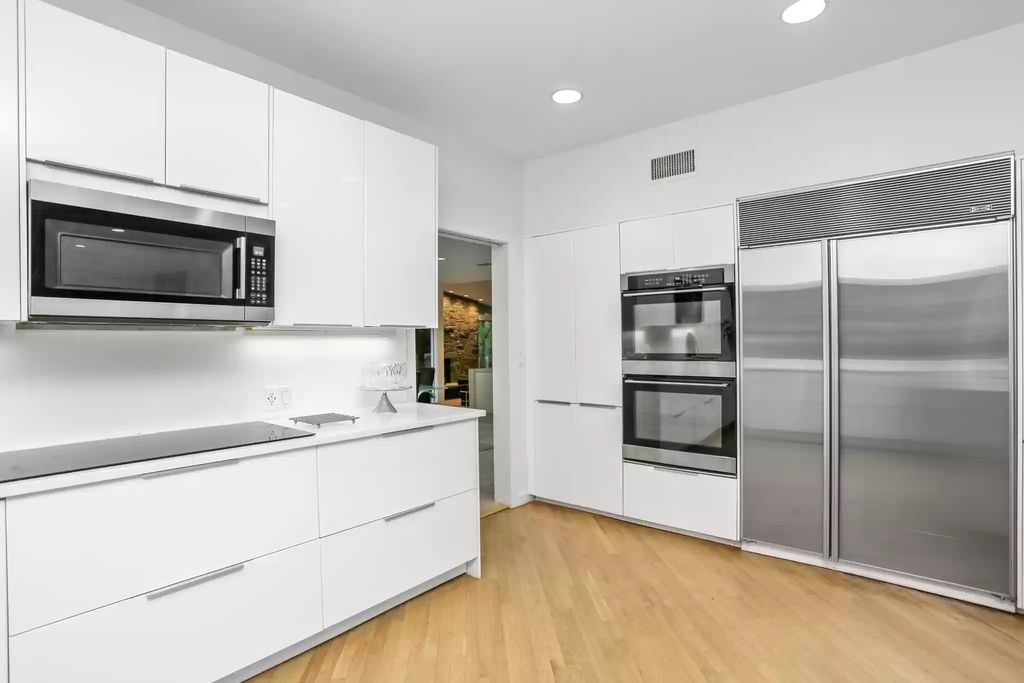 The House in Greenwich blends the verdant outdoors with open living spaces flooded with sunlight, now available for sale. This home located at 48 Lafrentz Rd, Greenwich, Connecticut