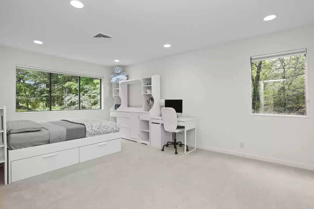 The House in Greenwich blends the verdant outdoors with open living spaces flooded with sunlight, now available for sale. This home located at 48 Lafrentz Rd, Greenwich, Connecticut
