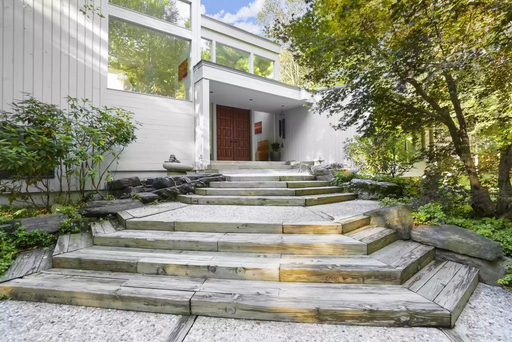 The House in Greenwich blends the verdant outdoors with open living spaces flooded with sunlight, now available for sale. This home located at 48 Lafrentz Rd, Greenwich, Connecticut