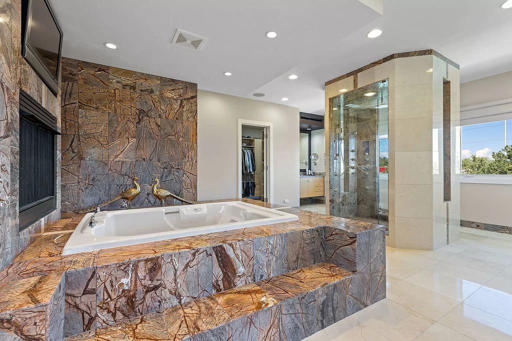 The Estate in Northbrook is a luxurious home featuring dualing staircase, large home office, indoor pool, home theatre, massive kitchen and much more appeal now available for sale. This home located at 925 Morrison Ln, Northbrook, Illinois, offering 06 bedrooms and 08 bathrooms with 8,960 square feet of living spaces. 