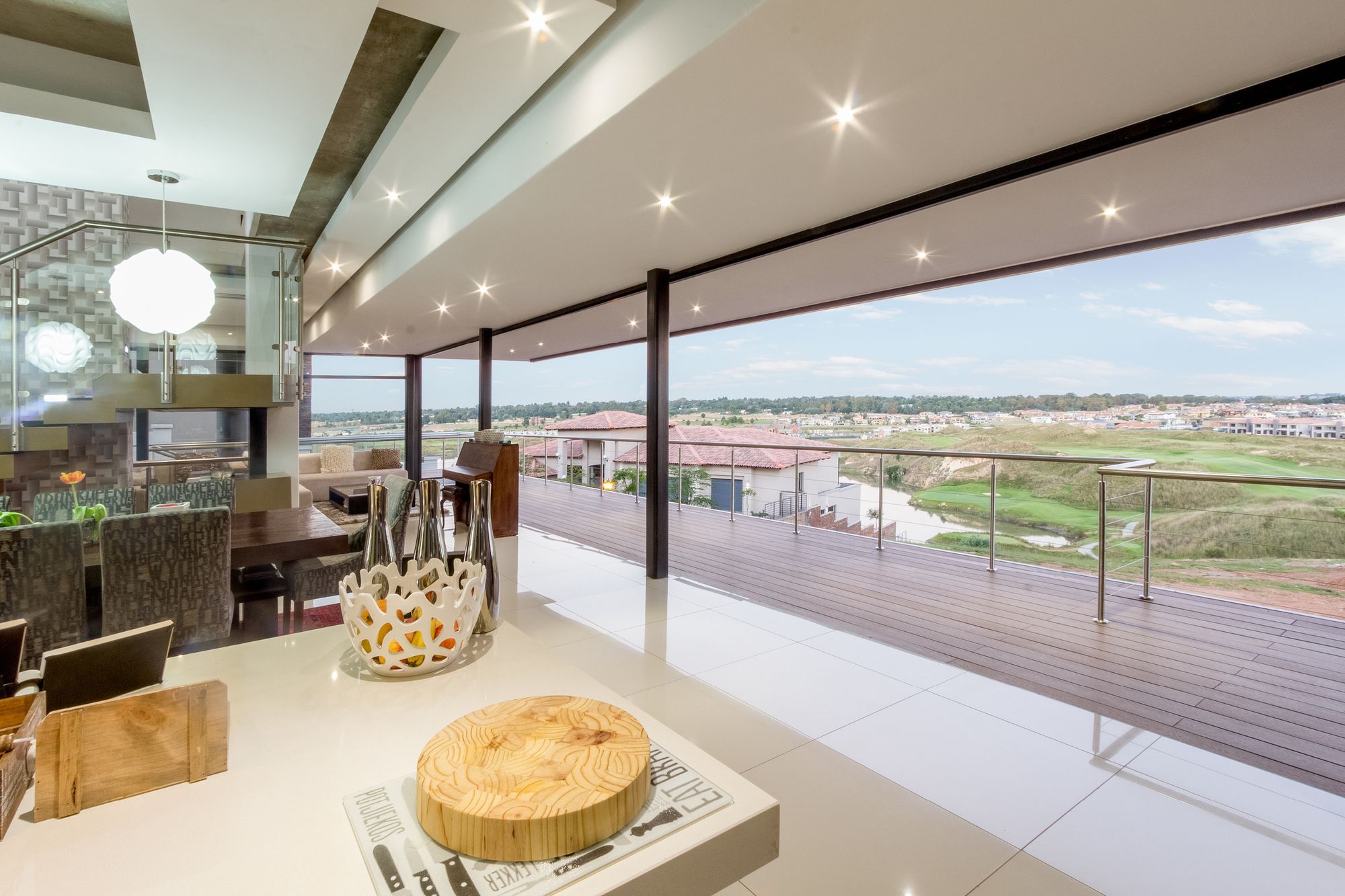 Spread across three different levels, a central courtyard that flows into the rear garden and sparkling recessed lighting put the final touches on a South African home where outdoor living takes precedence.