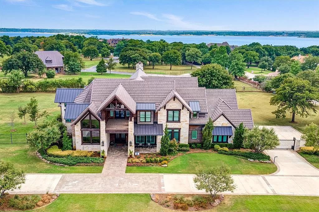 The Home in Flower Mound, a prominent 2 acre estate nestled in the gated and guarded neighborhood of Chateau de lac offering an impressive outdoor living and a picturesque entryway is now available for sale. This house located at 1901 Genevieve Ct, Flower Mound, Texas