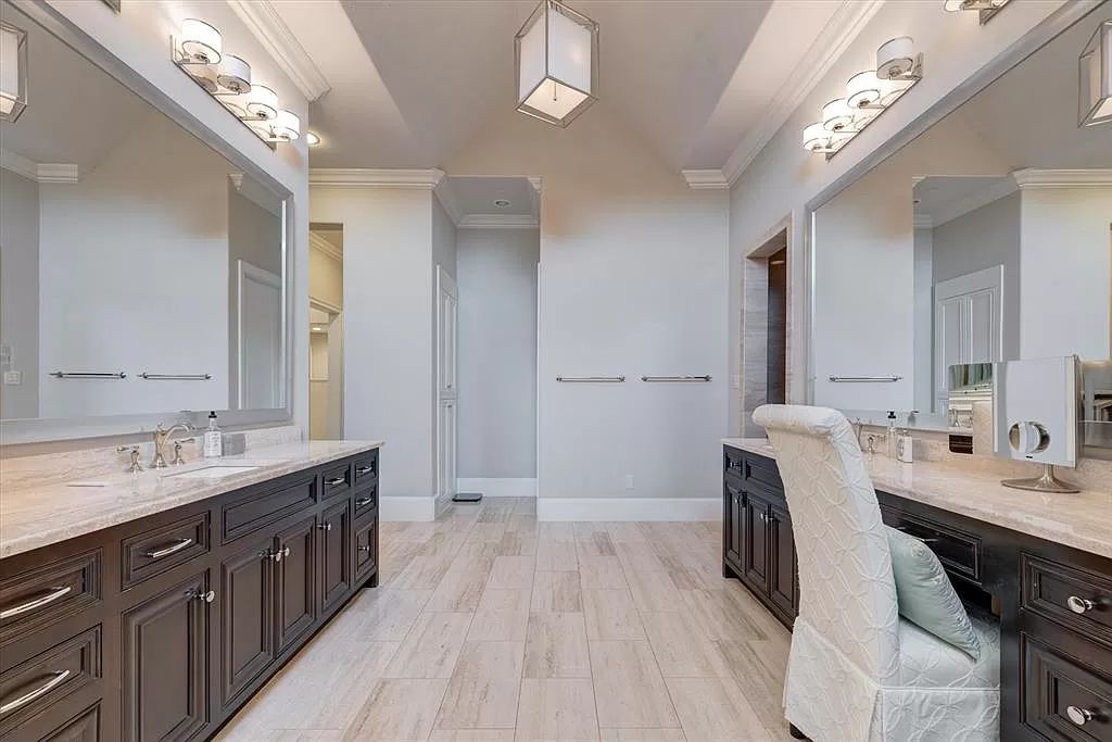 The Home in Flower Mound, a prominent 2 acre estate nestled in the gated and guarded neighborhood of Chateau de lac offering an impressive outdoor living and a picturesque entryway is now available for sale. This house located at 1901 Genevieve Ct, Flower Mound, Texas