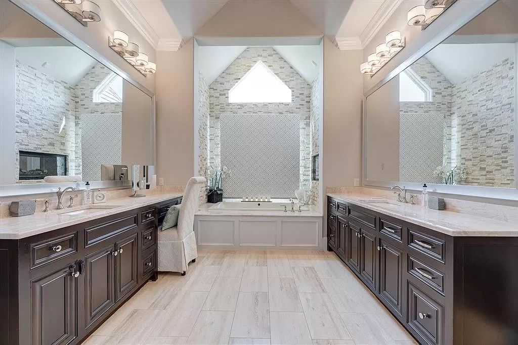The Home in Flower Mound, a prominent 2 acre estate nestled in the gated and guarded neighborhood of Chateau de lac offering an impressive outdoor living and a picturesque entryway is now available for sale. This house located at 1901 Genevieve Ct, Flower Mound, Texas