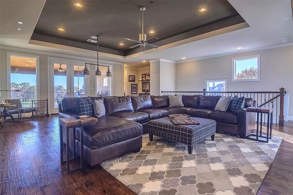 The Home in Flower Mound, a prominent 2 acre estate nestled in the gated and guarded neighborhood of Chateau de lac offering an impressive outdoor living and a picturesque entryway is now available for sale. This house located at 1901 Genevieve Ct, Flower Mound, Texas