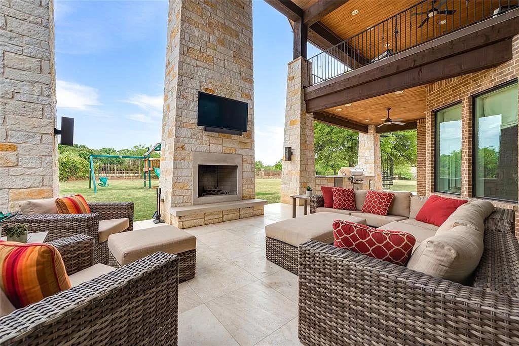 The Home in Flower Mound, a prominent 2 acre estate nestled in the gated and guarded neighborhood of Chateau de lac offering an impressive outdoor living and a picturesque entryway is now available for sale. This house located at 1901 Genevieve Ct, Flower Mound, Texas