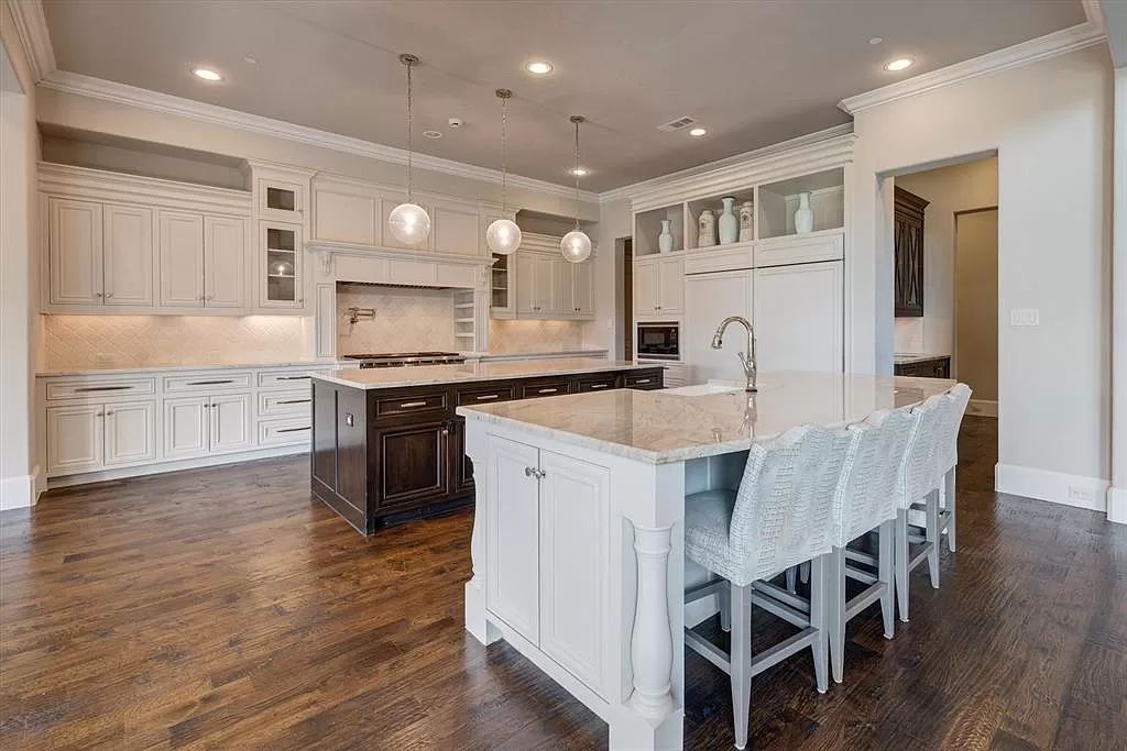 The Home in Flower Mound, a prominent 2 acre estate nestled in the gated and guarded neighborhood of Chateau de lac offering an impressive outdoor living and a picturesque entryway is now available for sale. This house located at 1901 Genevieve Ct, Flower Mound, Texas