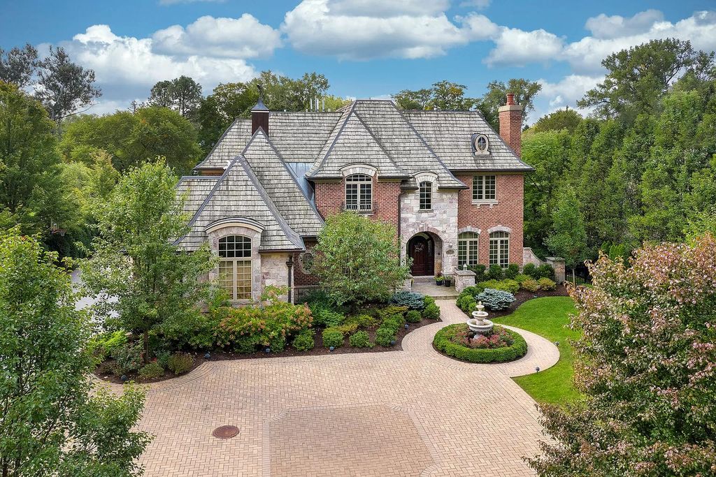 The Home in Winnetka is surrounded with picturesque perennial flower and organic vegetable gardens, lush grounds, now available for sale. This home located at 102 Longmeadow Rd, Winnetka, Illinois