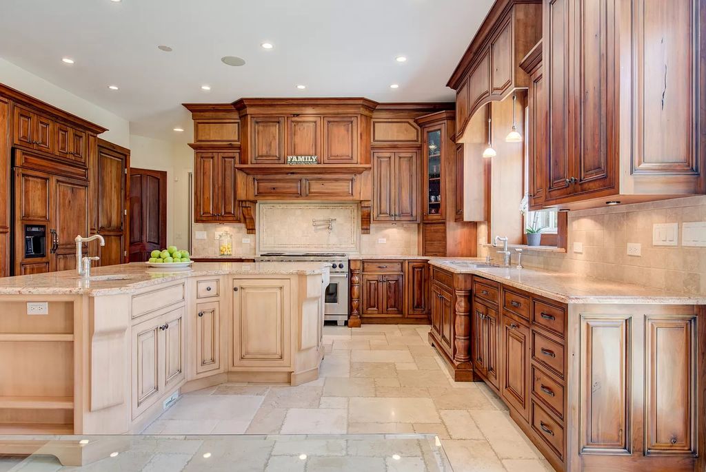 The Home in Winnetka is surrounded with picturesque perennial flower and organic vegetable gardens, lush grounds, now available for sale. This home located at 102 Longmeadow Rd, Winnetka, Illinois
