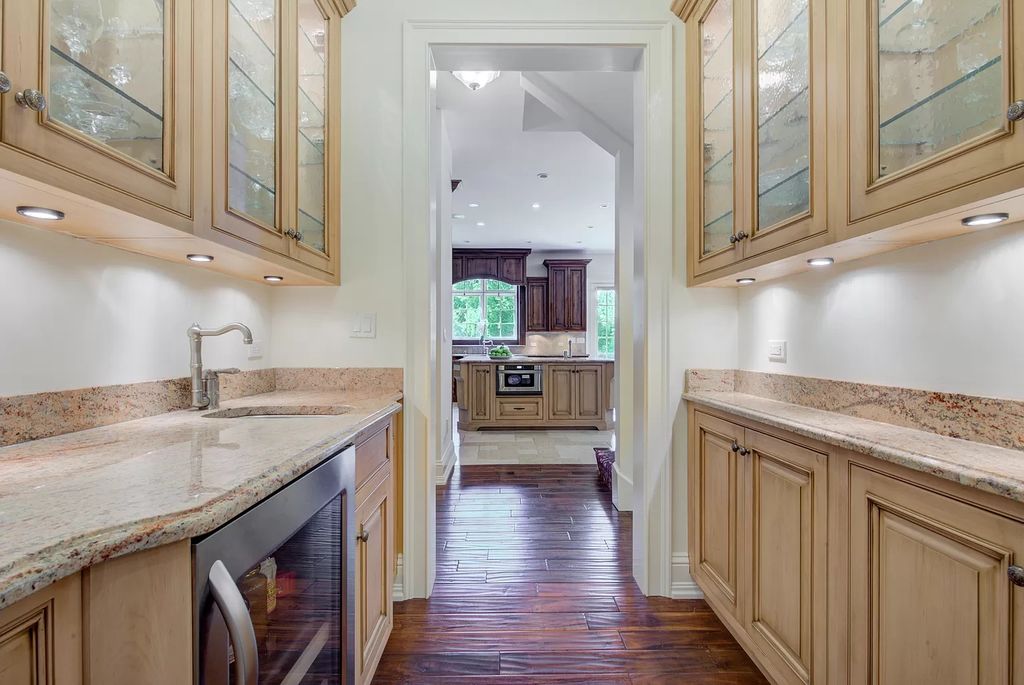 The Home in Winnetka is surrounded with picturesque perennial flower and organic vegetable gardens, lush grounds, now available for sale. This home located at 102 Longmeadow Rd, Winnetka, Illinois