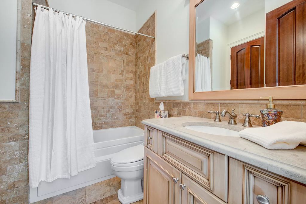 The Home in Winnetka is surrounded with picturesque perennial flower and organic vegetable gardens, lush grounds, now available for sale. This home located at 102 Longmeadow Rd, Winnetka, Illinois