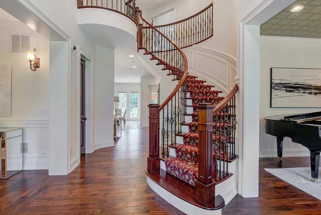 The Home in Winnetka is surrounded with picturesque perennial flower and organic vegetable gardens, lush grounds, now available for sale. This home located at 102 Longmeadow Rd, Winnetka, Illinois
