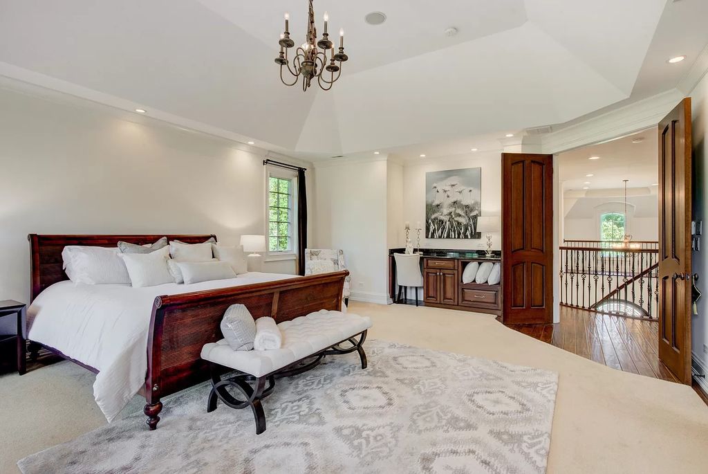The Home in Winnetka is surrounded with picturesque perennial flower and organic vegetable gardens, lush grounds, now available for sale. This home located at 102 Longmeadow Rd, Winnetka, Illinois
