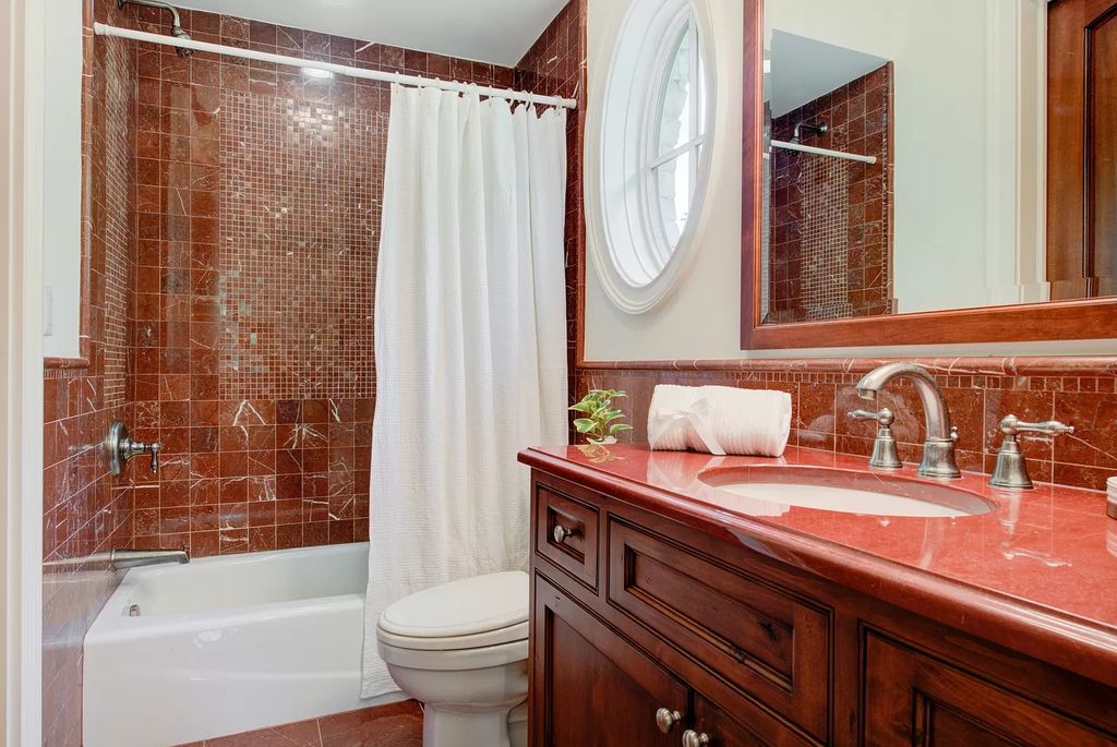 The Home in Winnetka is surrounded with picturesque perennial flower and organic vegetable gardens, lush grounds, now available for sale. This home located at 102 Longmeadow Rd, Winnetka, Illinois