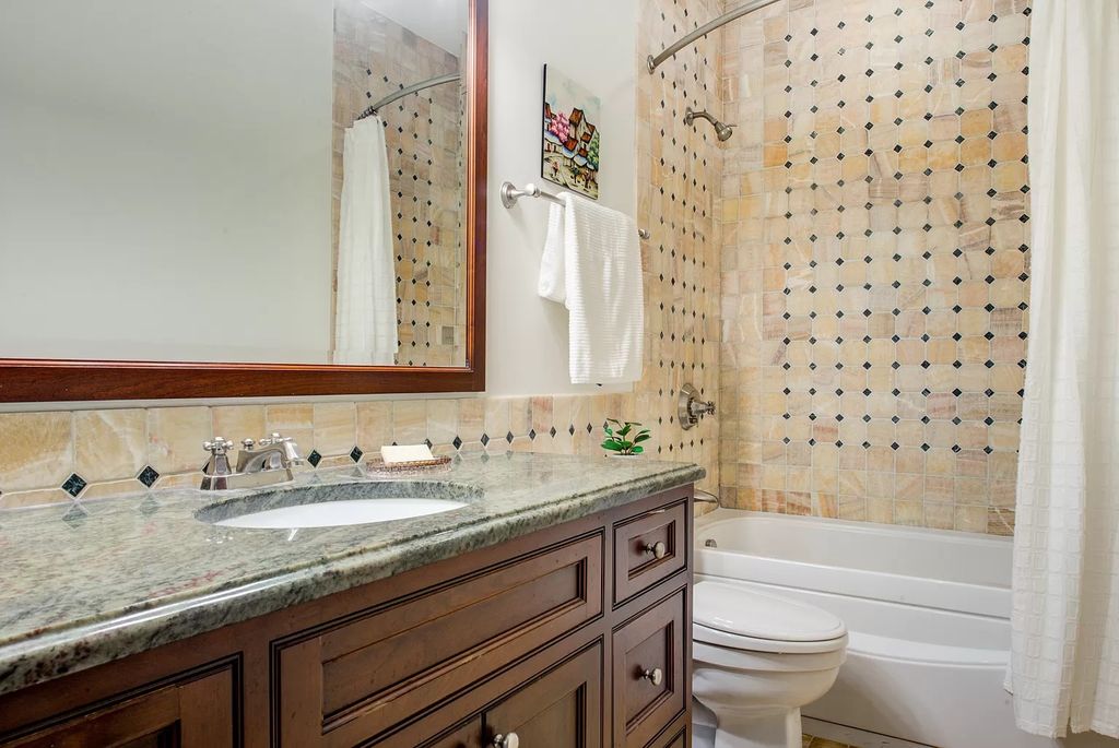 The Home in Winnetka is surrounded with picturesque perennial flower and organic vegetable gardens, lush grounds, now available for sale. This home located at 102 Longmeadow Rd, Winnetka, Illinois