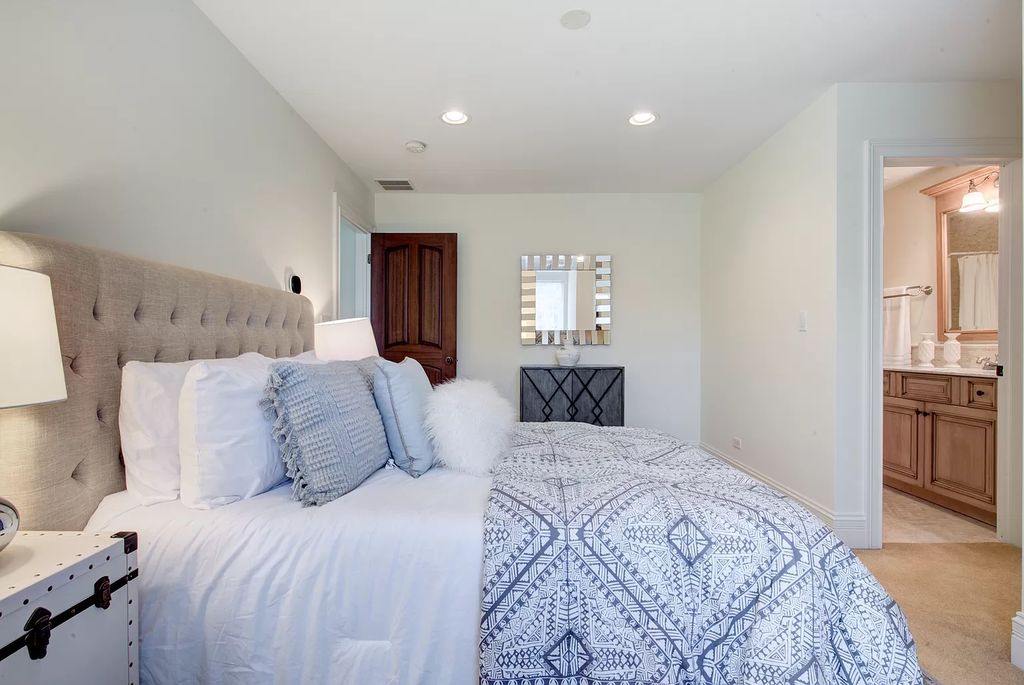 The Home in Winnetka is surrounded with picturesque perennial flower and organic vegetable gardens, lush grounds, now available for sale. This home located at 102 Longmeadow Rd, Winnetka, Illinois