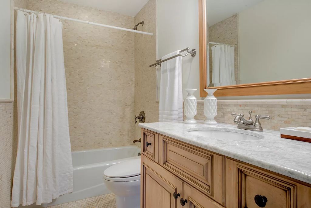The Home in Winnetka is surrounded with picturesque perennial flower and organic vegetable gardens, lush grounds, now available for sale. This home located at 102 Longmeadow Rd, Winnetka, Illinois