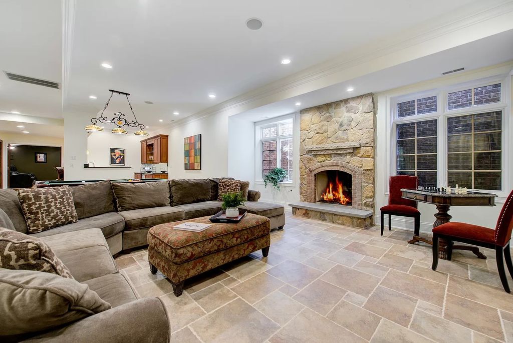 The Home in Winnetka is surrounded with picturesque perennial flower and organic vegetable gardens, lush grounds, now available for sale. This home located at 102 Longmeadow Rd, Winnetka, Illinois