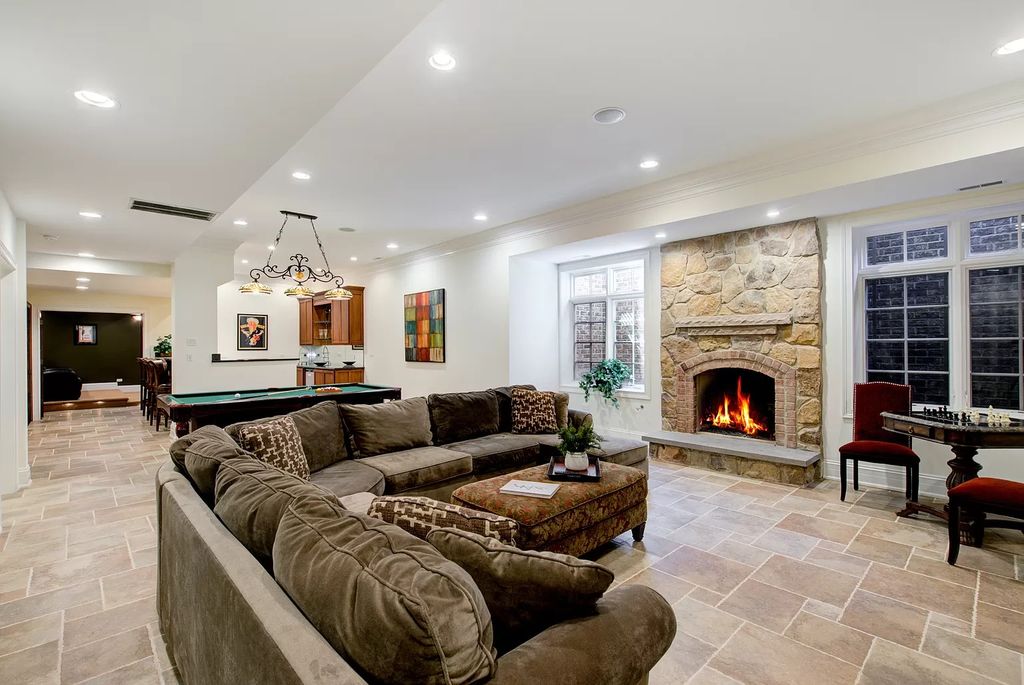 The Home in Winnetka is surrounded with picturesque perennial flower and organic vegetable gardens, lush grounds, now available for sale. This home located at 102 Longmeadow Rd, Winnetka, Illinois