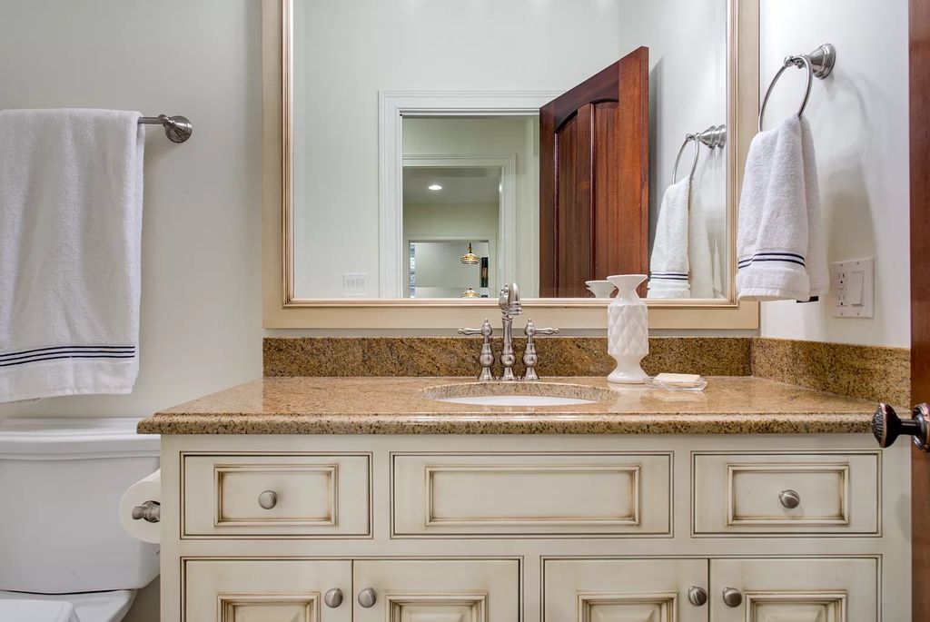 The Home in Winnetka is surrounded with picturesque perennial flower and organic vegetable gardens, lush grounds, now available for sale. This home located at 102 Longmeadow Rd, Winnetka, Illinois