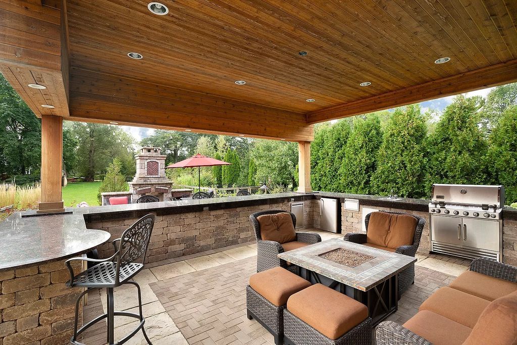 The Home in Winnetka is surrounded with picturesque perennial flower and organic vegetable gardens, lush grounds, now available for sale. This home located at 102 Longmeadow Rd, Winnetka, Illinois