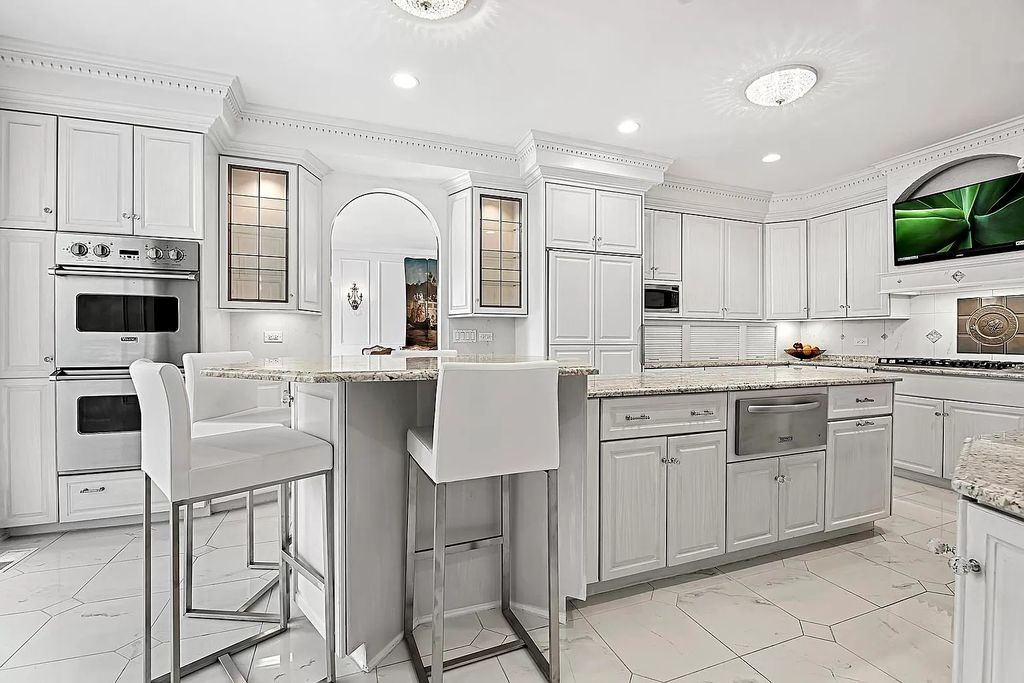 The Estate in Oak Brook is a luxurious home surrounded by beautifully manicured professionally landscaped gardens now available for sale. This home located at 704 Deer Trail Ln, Oak Brook, Illinois; offering 08 bedrooms and 10 bathrooms with 16,981 square feet of living spaces.